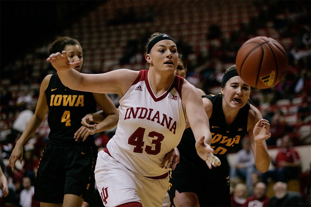 Junior center Jenn Anderson rushes for the ball before it goes out of bounds. Anderson was second in scoring with 18 points against Iowa. The Hoosiers won 79-74 Thursday night at Assembly Hall.