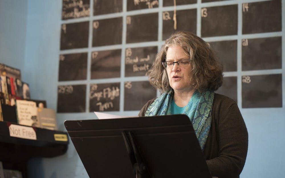 Shayne Laughter reads her short story described as part "good cop, bad cop" and part fantasy at the prose readying at Boxcar Book Sunday afternoon. The event, sponsored by The Writer's Guild at Bloomington, features writers and an open mic time every first Sunday from 3-5pm.