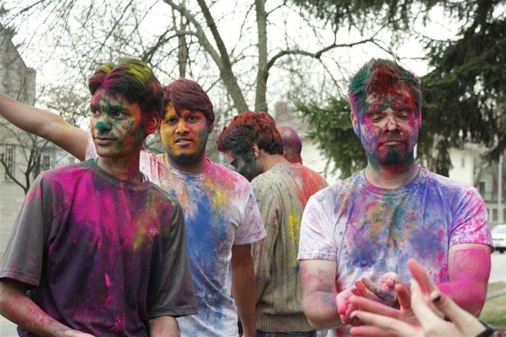 Graduate students Rahul Gupta,  Kshitiz Anand, and Brandon Stephens celebrated Holi at IU's Asian Culture Center Wednesday evening. 
