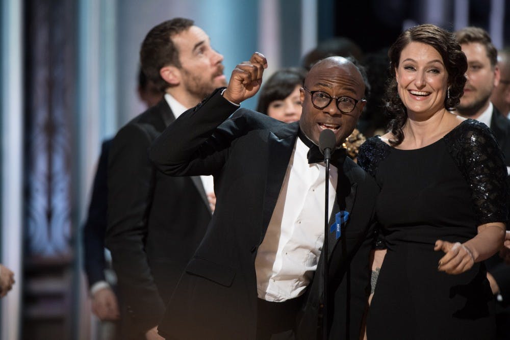 <p>Barry Jenkins, writer and director of "Moonlight," and producer Adele Romanski accept the Oscar for best picture during 2017 the Academy Awards. "La La Land" was first read as the winner, but the actual winner was "Moonlight."</p>