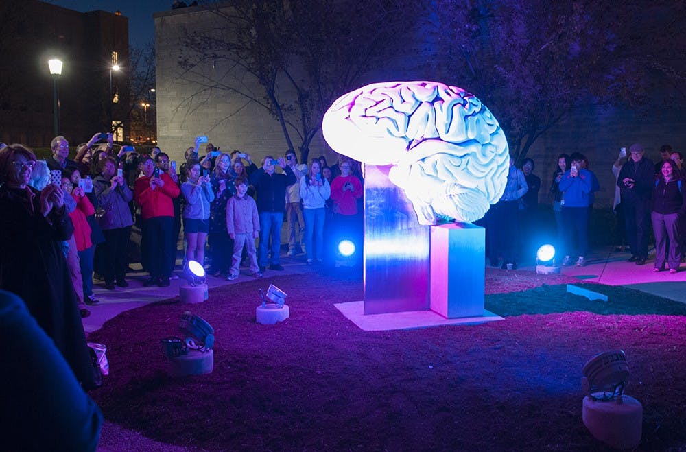 The brain sculpture outside of the Psychology building is illuminated for the first time on Thursday evening. The lights that illuminate the sculpture have a lifespan of 100,000 hours. The funds for the lighting design were donated by IU graduates David and Suzanne Pfenninger. 