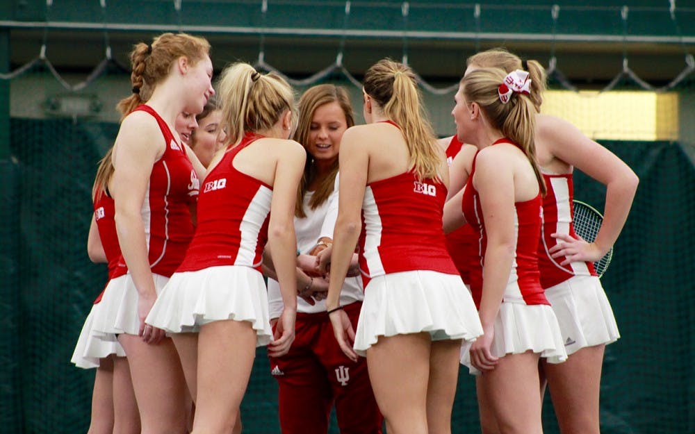 IU women's tennis huddles before a Saturday morning match against Notre Dame in 2017.