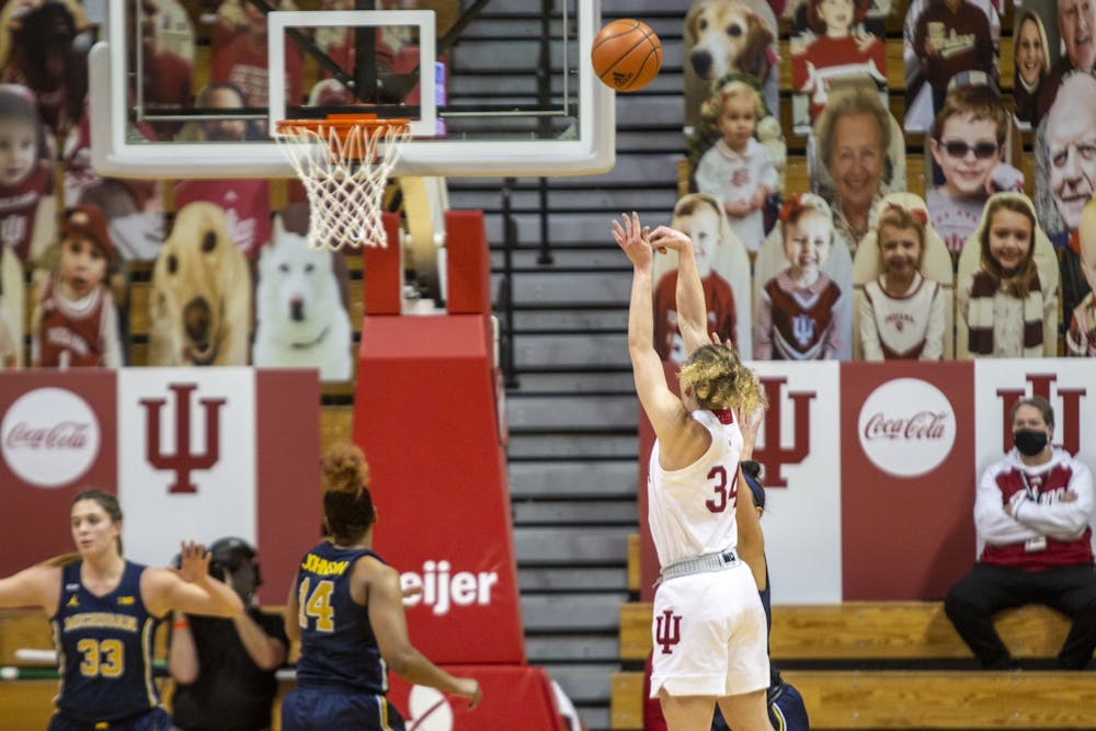 <p>Junior guard Grace Berger attempts a shot Feb. 18 in Simon Skjodt Assembly Hall. IU beat Ohio State 87-75 Saturday.</p>