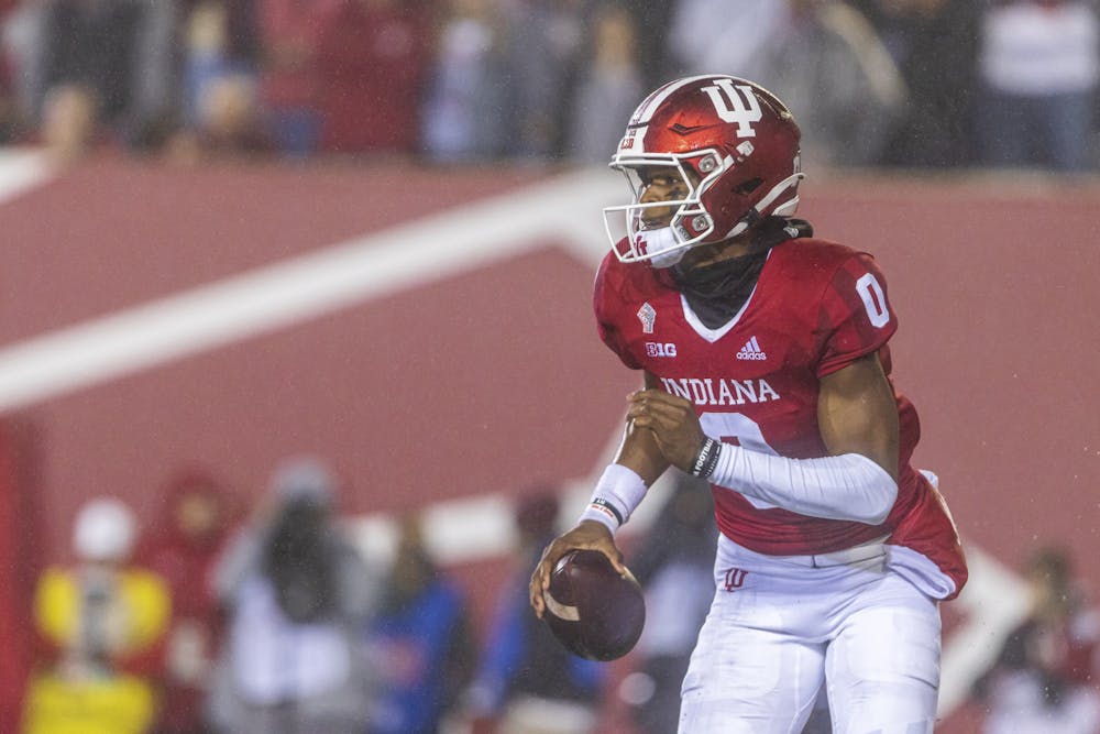 <p>Freshman quaterback Donaven Mcculley scrambles for a run Oct. 23, 2021, at Memorial Stadium. Mcculley earned his first collegiate start in the loss against Maryland on Saturday.</p>