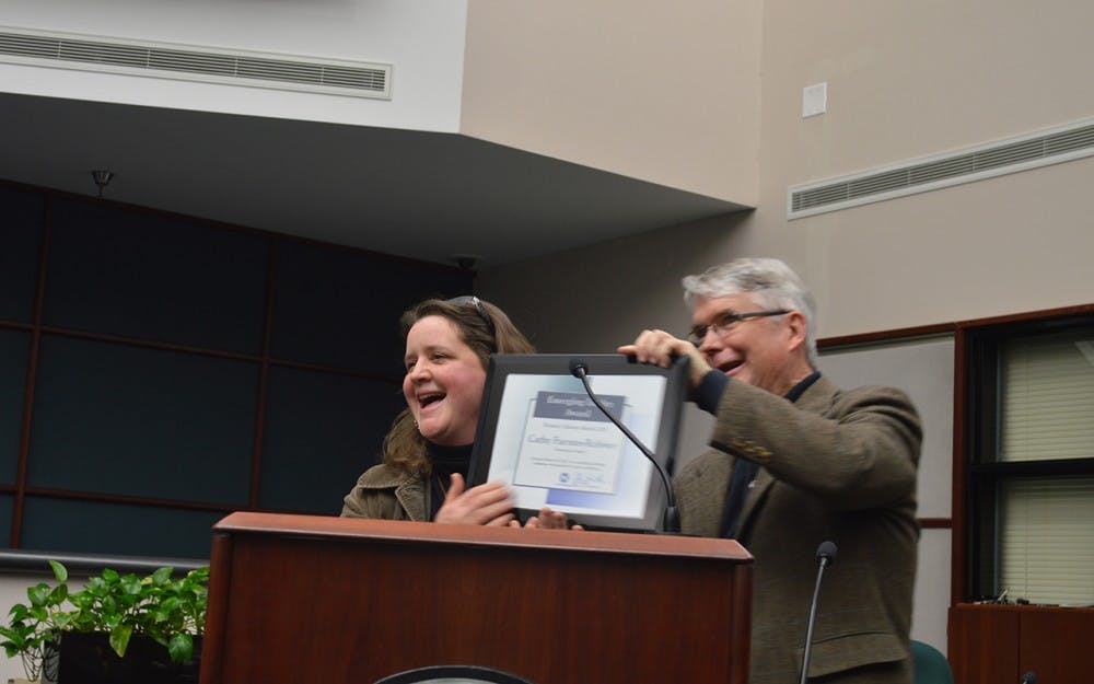 Bloomington Mayor John Hamilton&nbsp;congratulates Cathy Fuentes-Rohwer, the winner of the Emerging Leader Award,&nbsp;Thursday evening at the Women’s Leadership Development Event. The event was put on&nbsp;by the Bloomington Commission on the Status of Women. &nbsp;