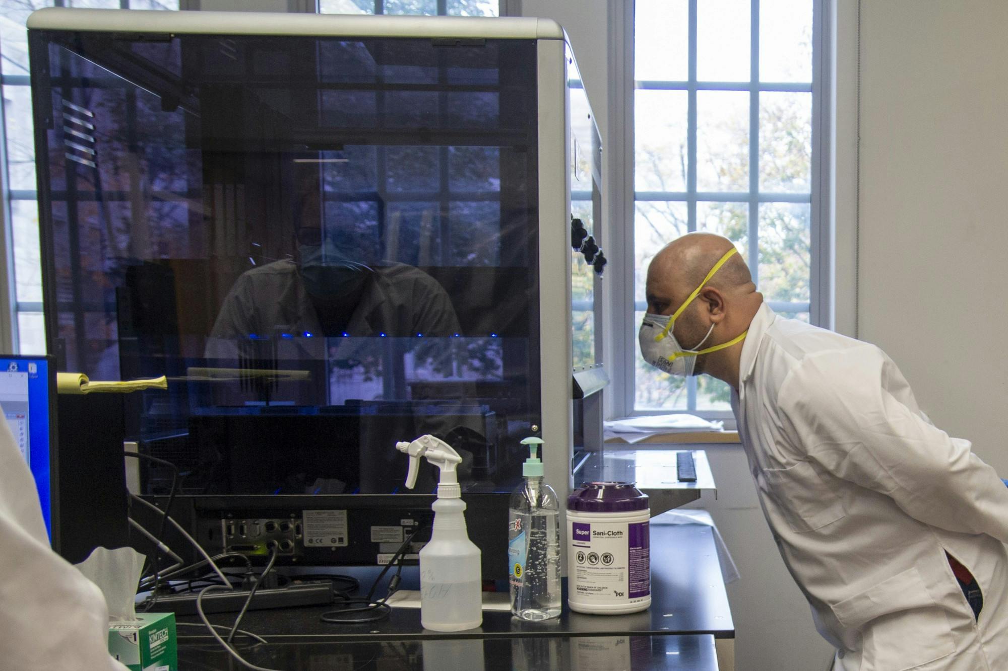 Technician Ahmed Alazawi monitors the machine