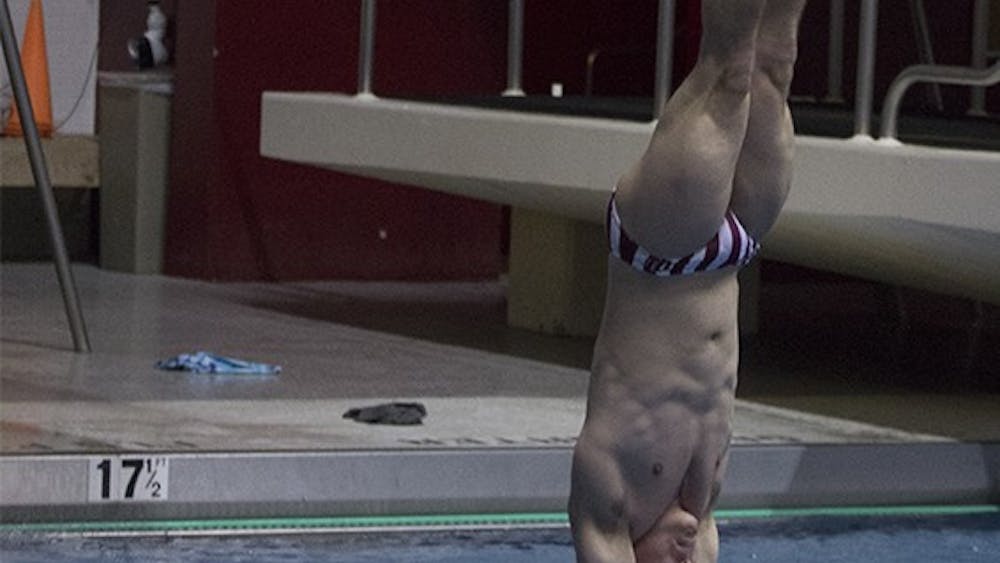 Diver Joshua Arndt goes into his fifth dive of the three-meter competition on Oct. 30 at Counsilman Billingsley Aquatic Center. Arndt competed with Cody Coldren and nine other divers in the quad meet.