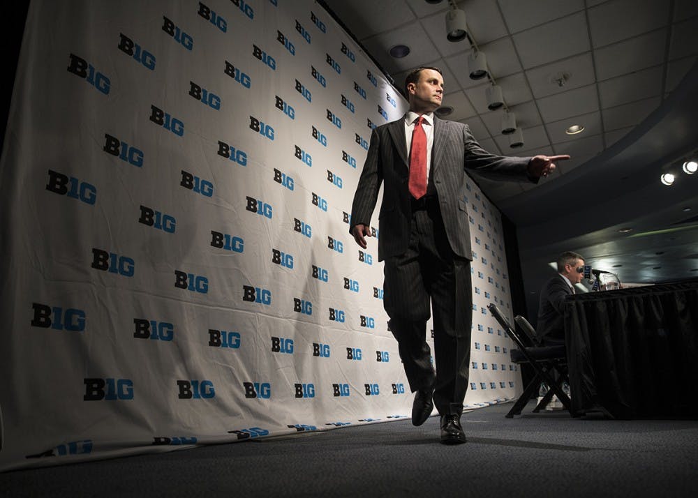 <p>Head Coach Archie Miller walks off stage after a press conference during Big Ten Media day at Madison Square Garden on Thursday.&nbsp;</p>
