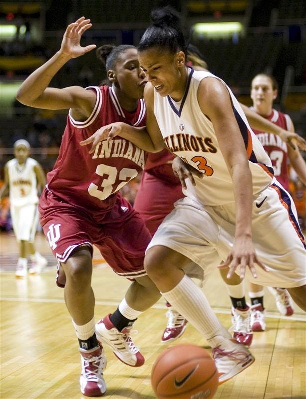 Sophomore guard Jori Davis, 32, guards Jenna Smith, 13, Sunday at Illinois. The Hoosiers lost 61-52.