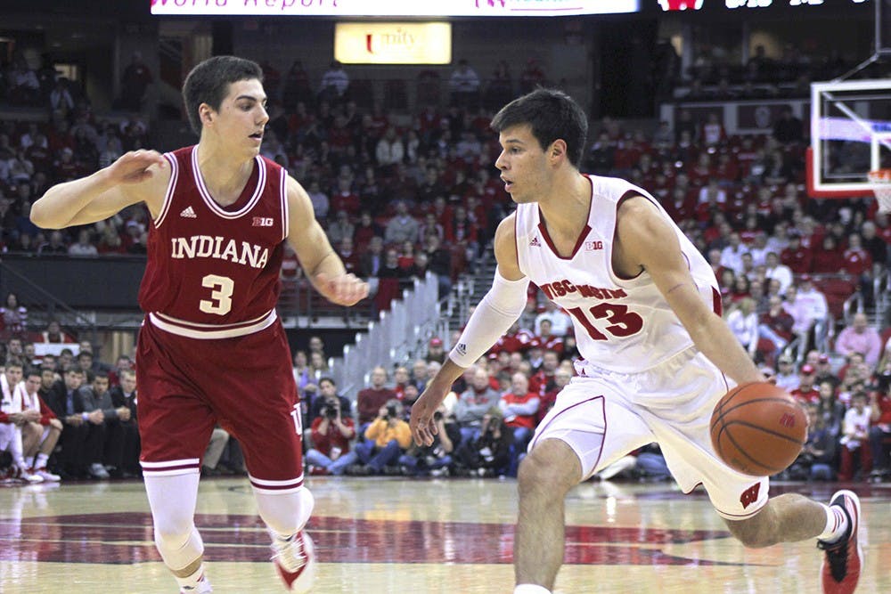 Freshman forward Max Hoetzel guards Wisconsin forward Duje Dukan on Tuesday at Kohl Center. 
