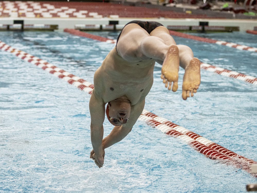 Freshman Rafael Miroslaw dives into the pool during the men&#x27;s 400-yard relay against Purdue on Jan. 22, 2022, at the Counsilman Billingsley Aquatic Center. Indiana finished in fifth place at the NCAA Championships in Atlanta, Georgia.