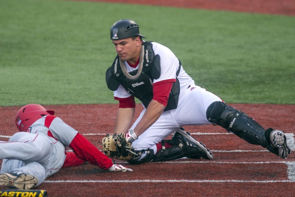 <p>Then-junior Kyle Schwarber tags a player out at home plate during IU's game against Western Kentucky on April 16, 2014, at Bart Kaufman Field. Schwarber participated in the MLB Home Run Derby on Monday.</p>