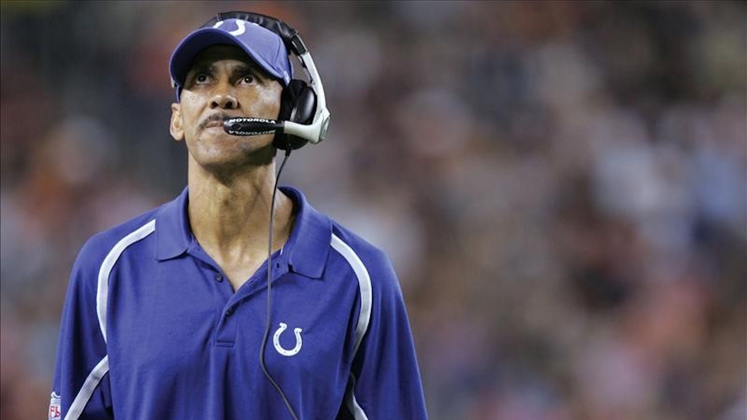 Indianapolis Colts head coach Tony Dungy looks to the sky as his team falls behind in the second half against the Broncos in Denver Aug. 27, 2005. The Broncos ended up winning, 37-24.