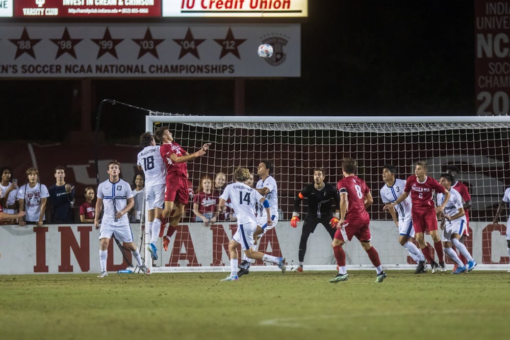<p>Then-freshman Mason Henderson challenges for the ball on Sept. 3, 2021, at Bill Armstrong Stadium. Indiana had five saves during the NCAA College Cup game against Rutgers.</p>