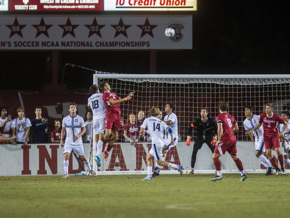 Then-freshman Mason Henderson challenges for the ball on Sept. 3, 2021, at Bill Armstrong Stadium. Indiana had five saves during the NCAA College Cup game against Rutgers.