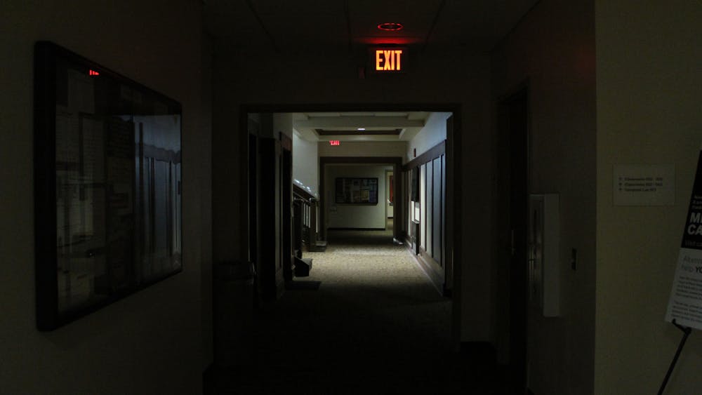 A basement hallway is covered in darkness Nov. 8, 2019, in Franklin Hall. A power outage on the northeast area of Bloomington has affected 567 Duke Energy customers.