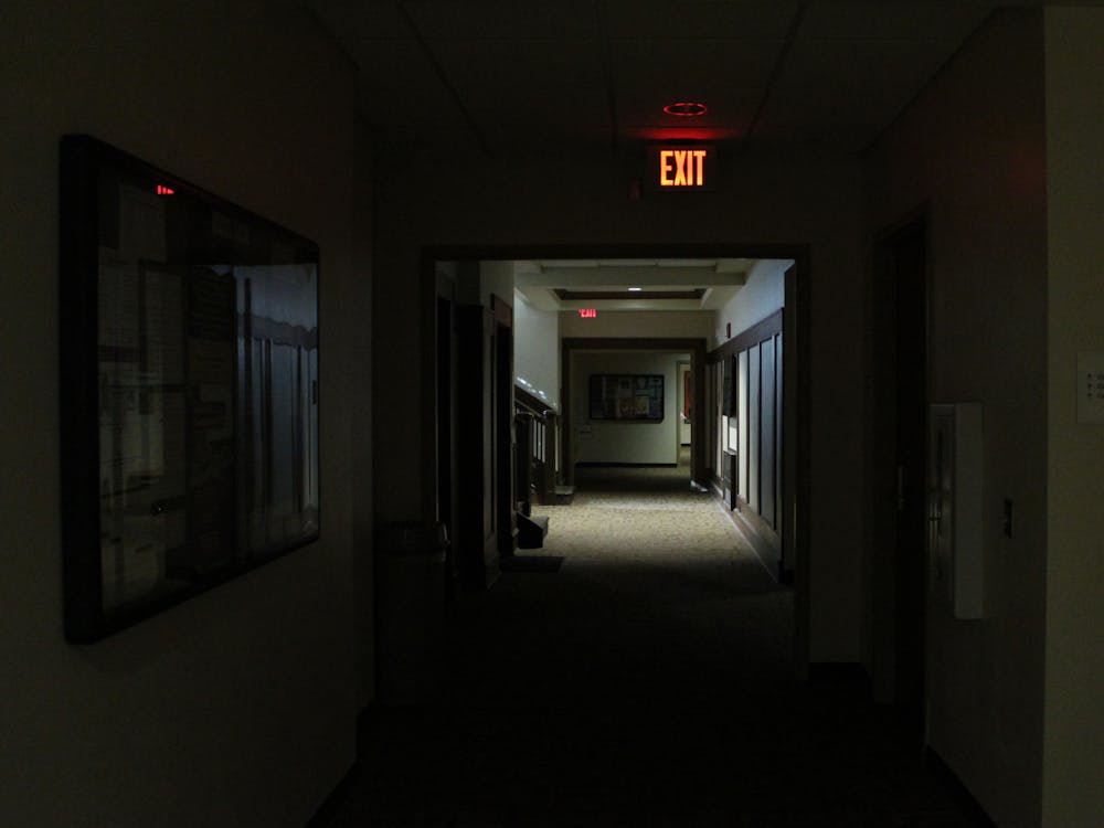 A basement hallway is covered in darkness Nov. 8, 2019, in Franklin Hall. A power outage on the northeast area of Bloomington has affected 567 Duke Energy customers.