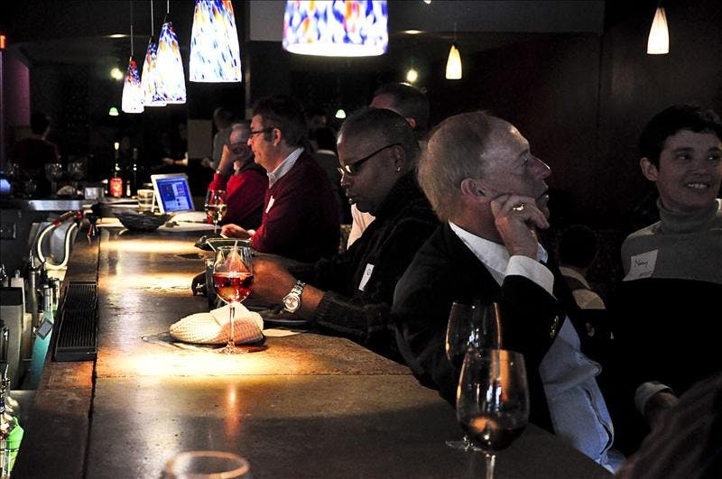 Patrons mix and mingle during the GLBTAA Homecoming Event and Silent Auction.