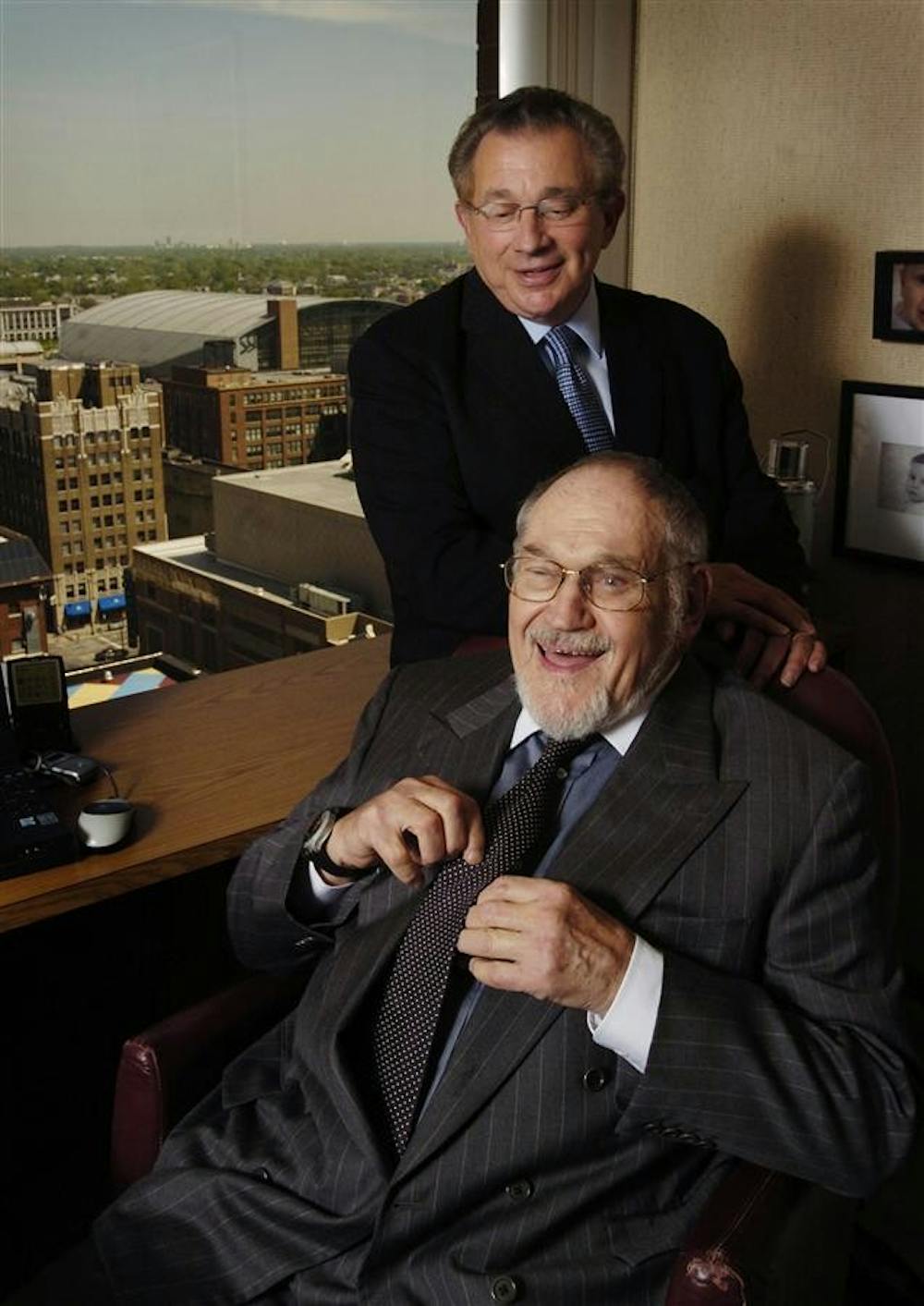 In this May 5, 2004 photo, Mel Simon, foreground, and his brother, Herb, pose in their office in Indianapolis. A spokesman says billionaire shopping mall magnate and Indiana Pacers co-owner Mel Simon died Wednesday, Sept. 16, 2009. He was 82. (AP Photo/Indianapolis Star, Matt Kryger)