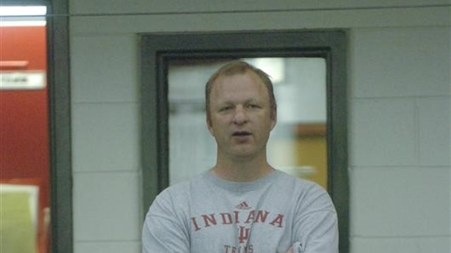 IU Mens tennis coach Randy Bloemendaal watches the mens tennis team practice Tuesday afternoon at the IU Tennis center.