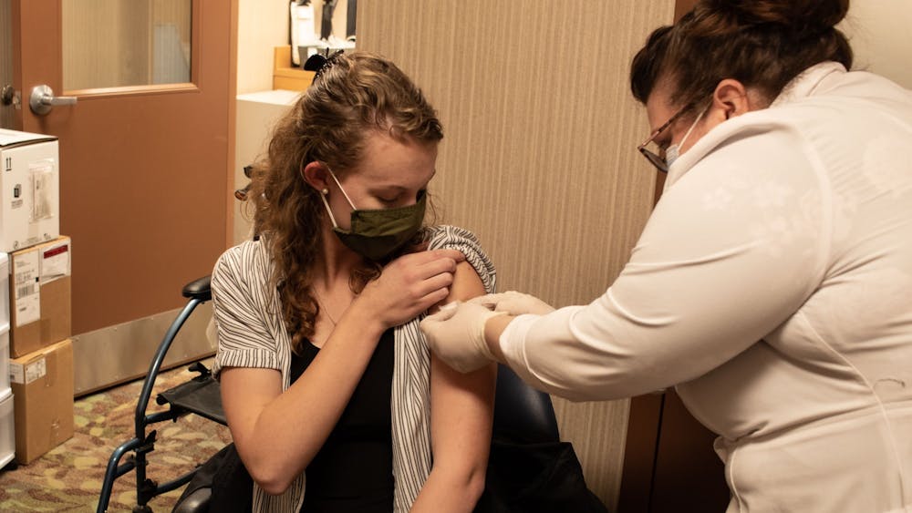Sophomore Kathryn Mick receives the first round of the Pfizer vaccine Monday. Vaccines are free to all eligible residents, regardless of insurance, according to Healthline. 