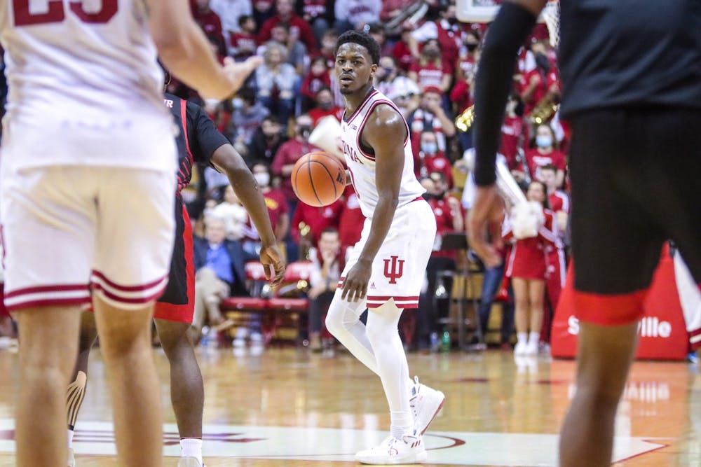 <p>Senior guard Xavier Johnson looks to make a pass Nov. 21, 2021, at Simon Skjodt Assembly Hall. Indiana defeated Little Rock, winning its fifth consecutive game.</p>