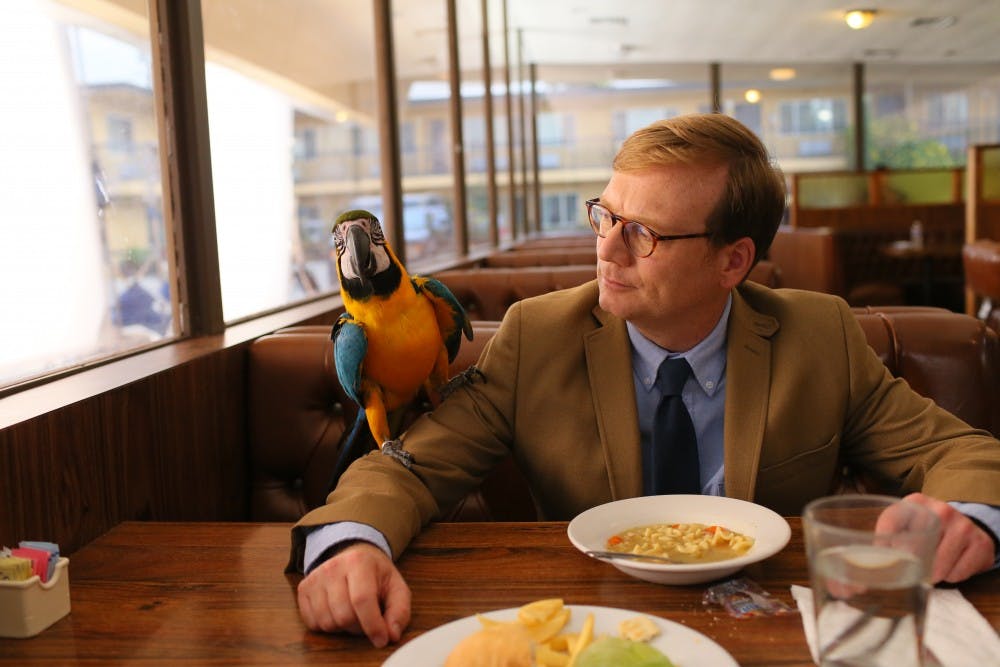 Andy Daly's Forrest MacNeil gazes lovingly at his one true companion after his wife left him in Comedy Central's "Review"