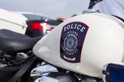 The IU Police Department crest can be seen on the gas tank of one of the IUPD motorcycles at the “Touch a Truck” event Monday in the Chick-fil-A parking lot at 3020 E. Third St.