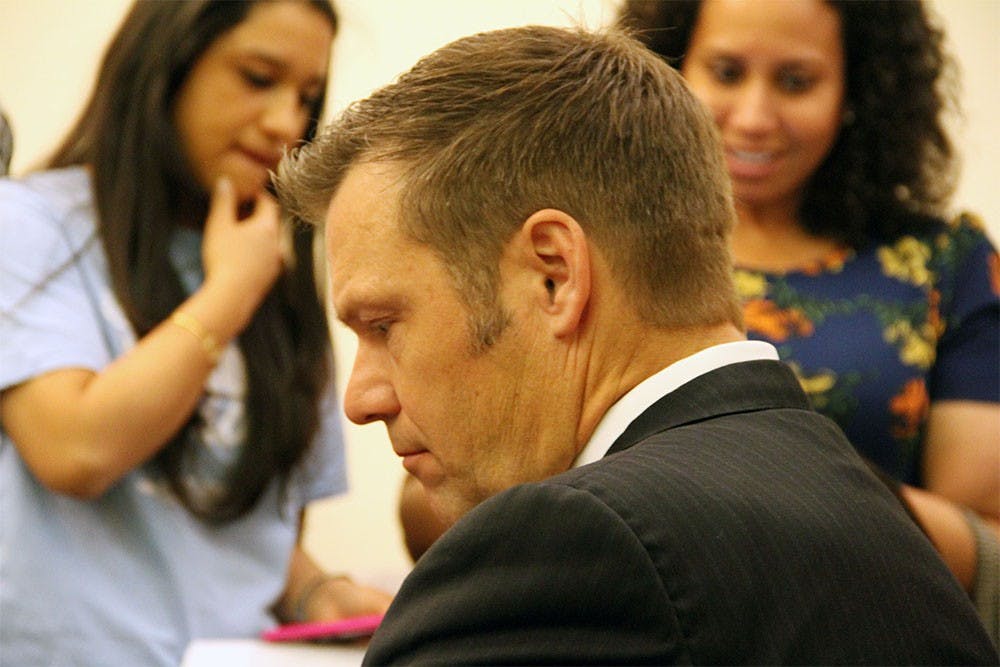 Kris Kobach waits to testify before a senate committee on immigration issues Tuesday. Kobach has a history in strict immigration legislation, including helping to draft Arizona's SB 1070, and advising presidential candidate Donald Trump on his plan to bill Mexico for a border wall.