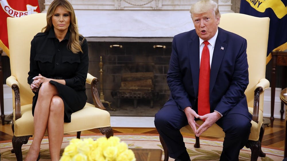 President Donald Trump and first lady Melania Trump sit in the Oval Office on Sept. 11 in the White House. They met with Food and Drug Administration acting Commissioner Norman Sharpless and Health and Human Services Secretary Alex Azar to discuss the health hazards of vaping.
