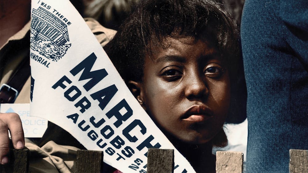 A girl holds a banner Aug. 28, 1963, at the March on Washington for Jobs and Freedom. 