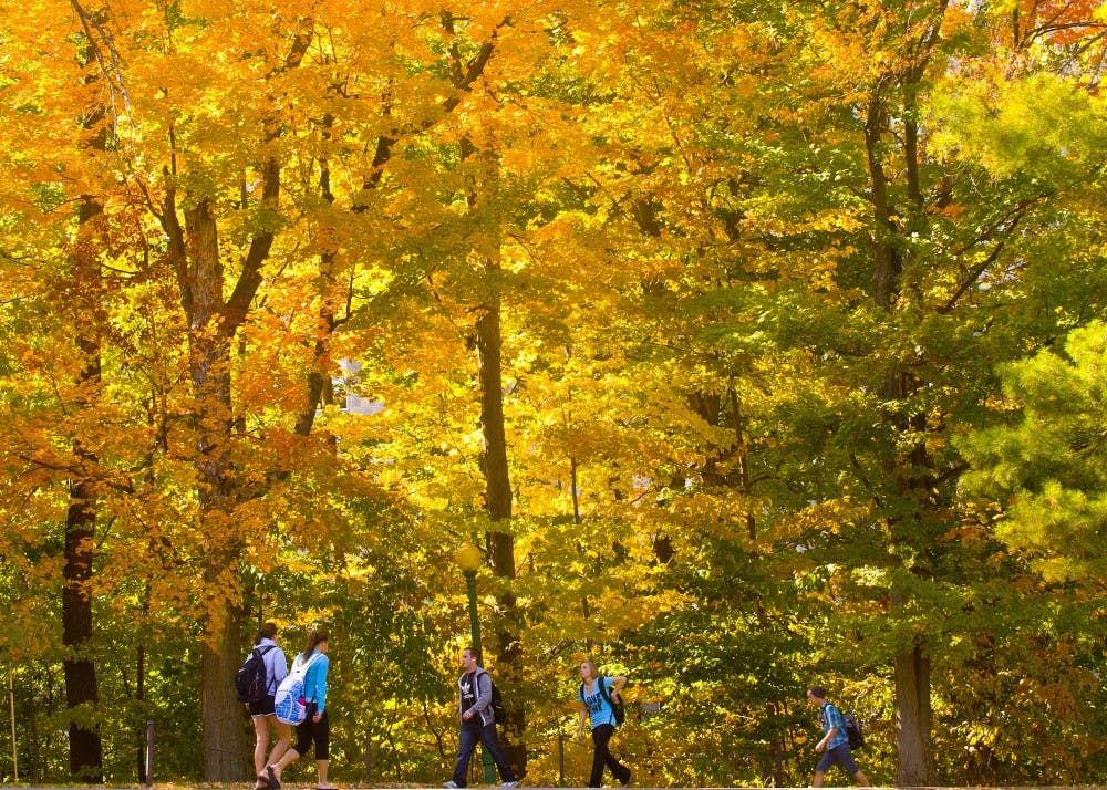 Students walk during a break from classes between Ballantine Hall and Goodbody Hall.