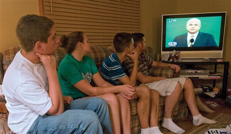 Senior Justin Cutter, junior Lauren Reckley, junior Jay Neel, and senior Shawn Azman watch Republican presidential candidate John McCain's acceptance speech Thursday night at an event hosted by the IU College Republicans.