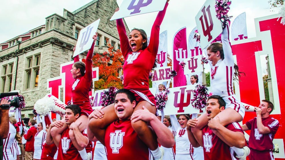 Kylie Cisney
Cheerleaders rally in front of the Sample Gates during the Oct. 17, 2014 homecoming parade.
