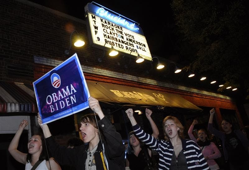Students march early Wednesday past the Bluebird on Walnut Avenue after it was announced that Barack Obama had won the presidency. Many Obama supporters gathered at the restaurant to watch election coverage. Marchers started at Collins Living-Learning Center and marched to Showalter Fountain, Kirkwood Avenue and ended at the Obama office at 9th Street and Walnut Avenue.