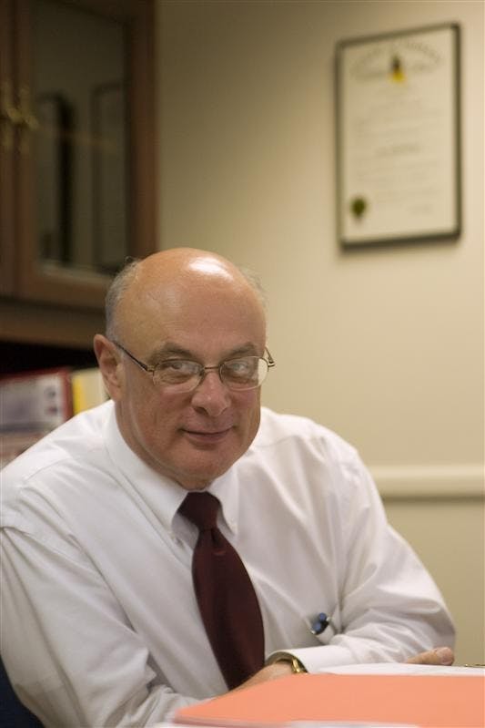 Assistant Vice President of IU Communications Larry MacIntyre sits in his office Wednesday afternoon at Bryan Hall.