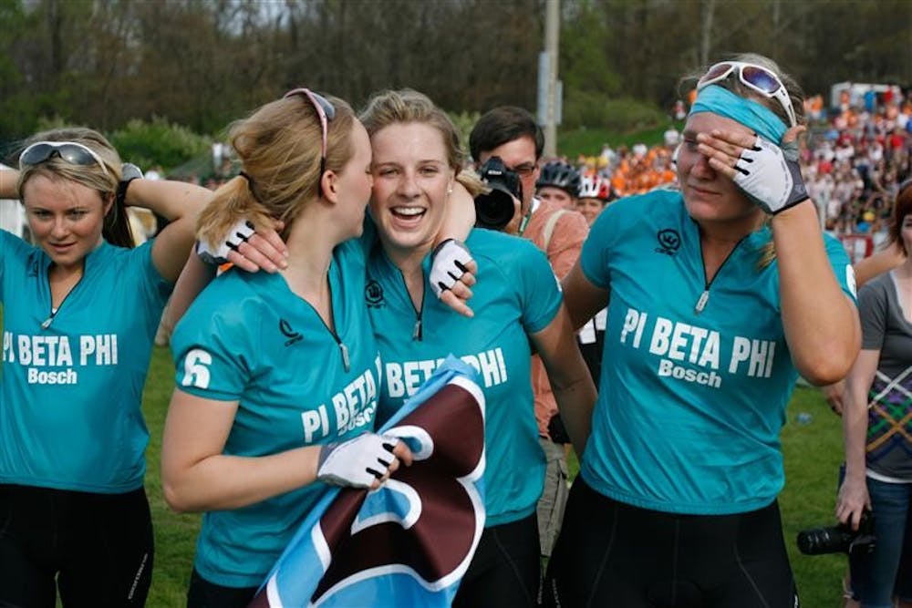 Pi Beta Phi riders sophomore Liz Mackey, senior Hayley Bakker, junior Caroline Brown and junior Natalie Malone walk to the podium to recieve their 1st-place trophy for winning the 2009 women's Little 500.