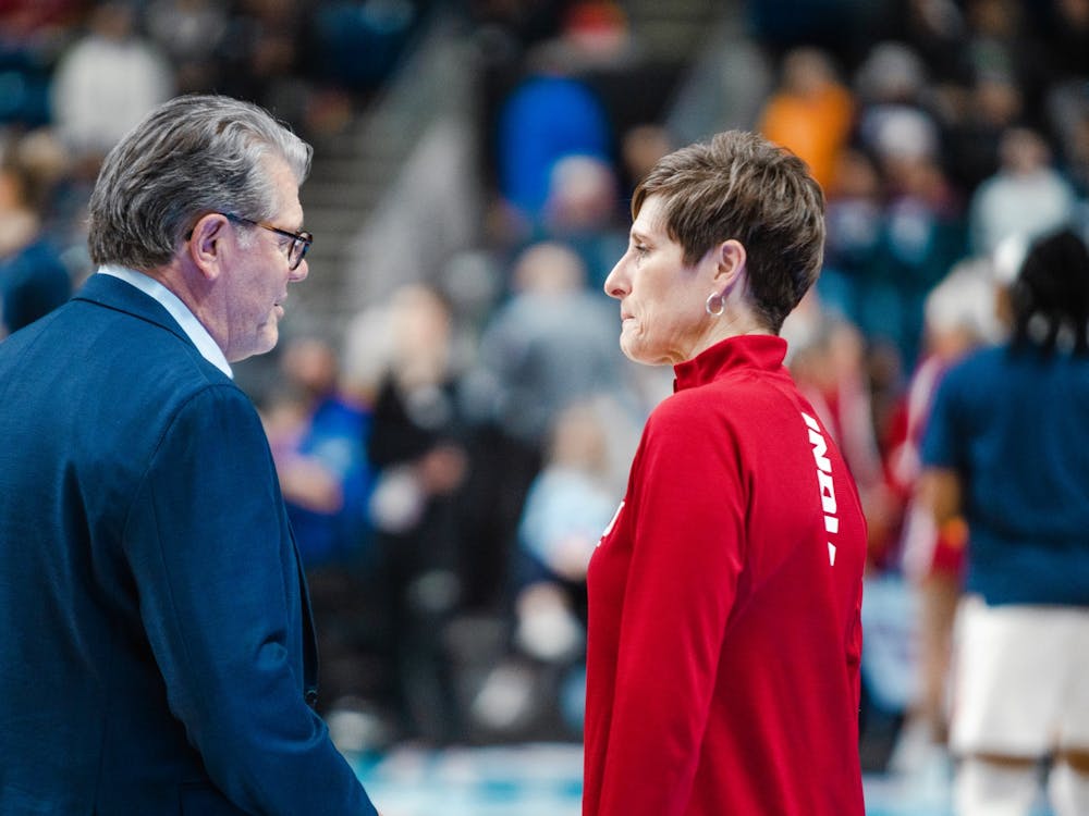 Head coaches Teri Moren and Geno Auriemma shake hands and talk before the Sweet Sixteen game Mar. 26, 2022, at Total Mortgage Arena in Bridgeport, Conn. Indiana lost 75-58 against the University of Connecticut.
