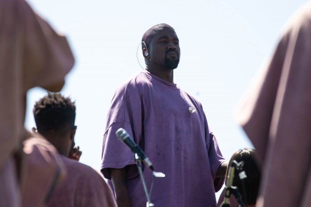 <p>Singer Kanye West stands during his Sunday service performance this past April at Coachella. West released his new album &quot;Jesus Is King&quot; on Oct. 25. </p>