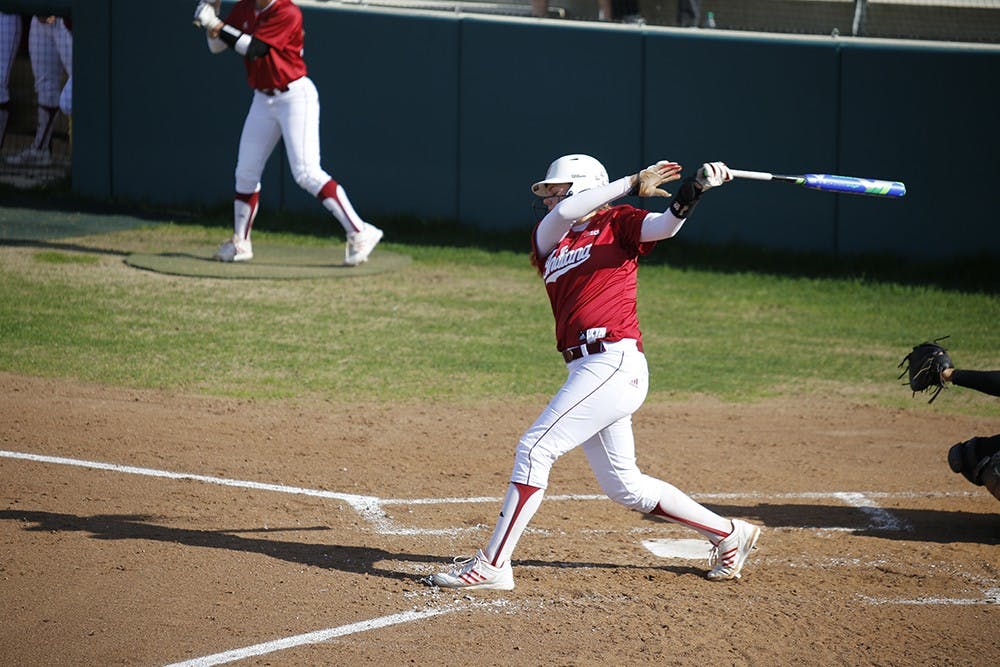 Freshman Infielder Taylor Uden swings her bat during IU's first game against Purdue Wednesday at the Andy Mohr Field. IU won 6-3 after Mena Fulton hit a 3-run home run during the last inning of the game. 