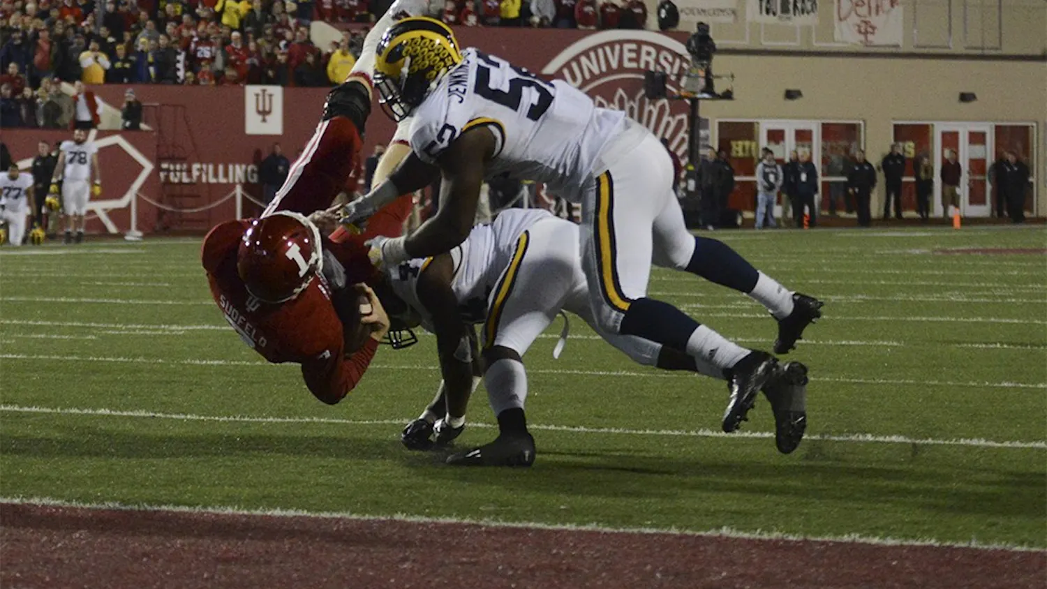 Quarterback Nate Sudfeld is tackled short of the goal line in the second overtime against Michigan on Saturday at Memorial Stadium. The Hoosiers lost in double overtime, 41-48.
