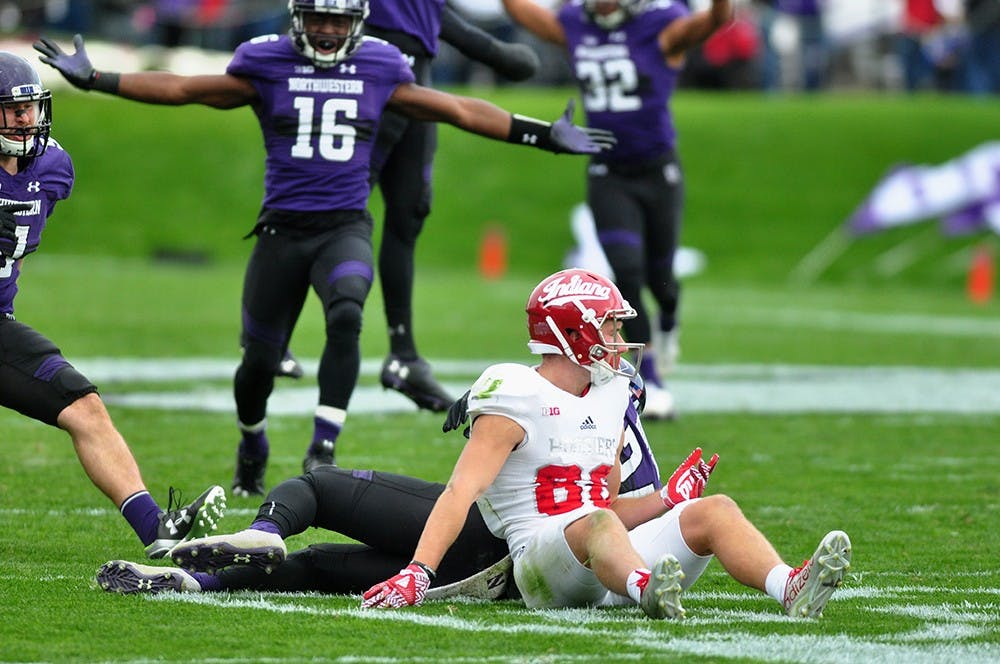 Sophomore wide receiver Luke Timian gets off the field after a pass intended for him results in an interception. Indiana lost 24-14.