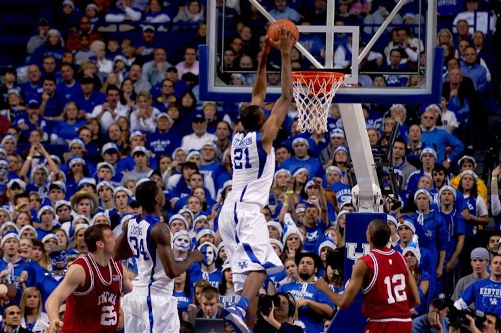 Kentucky's Perry Stevenson dunks on IU's Verdell Jones III and Tom Pritchard during IU's 72-54 loss to Kentucky on Saturday in Lexington, Ky.