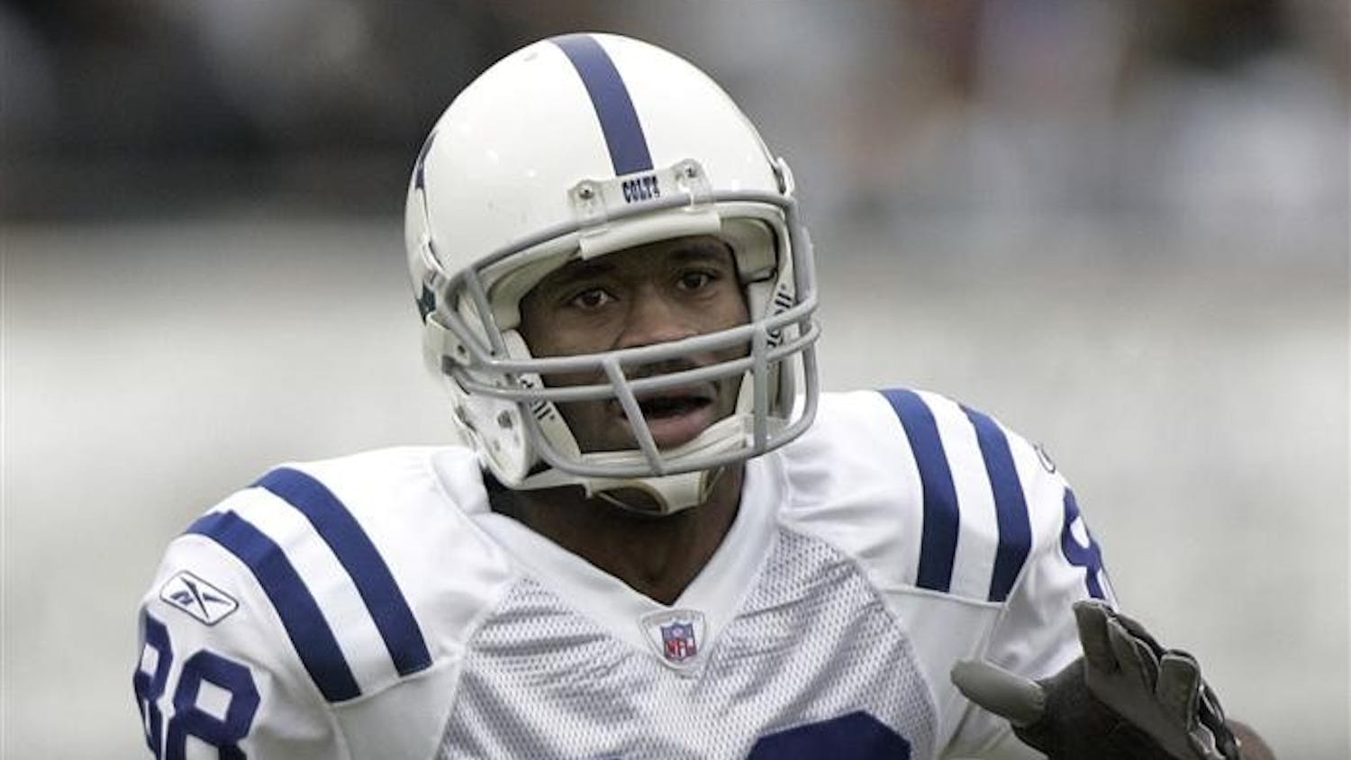 In this Dec. 11, 2005, file photo, Indianapolis Colts receiver Marvin Harrison scores a touchdown against the Jacksonville Jaguars in an NFL football game in Jacksonville, Fla. Harrison's reluctance to take a pay cut could mark the end of his career in Indianapolis.