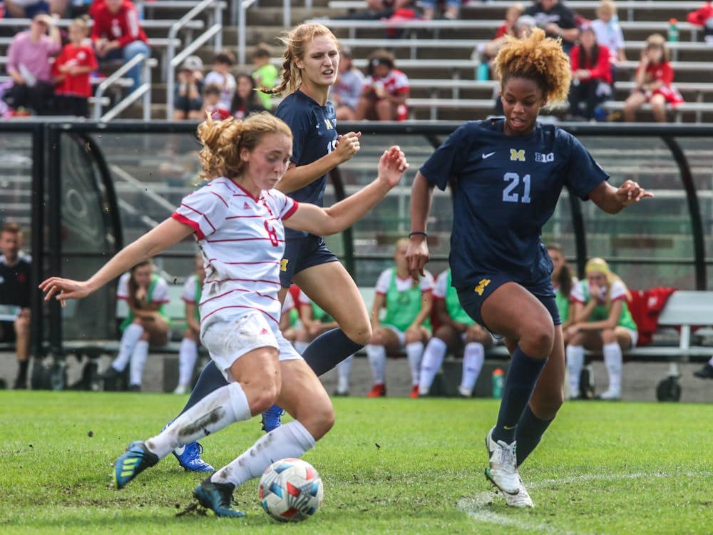 Junior midfielder Avery Lockwood goes to kick the ball Oct. 3, 2021, in Bill Armstrong Stadium against Michigan. Indiana lost its final regular-season game against No. 18 Purdue.