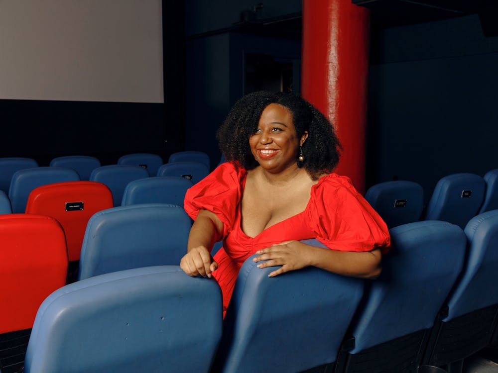 Black Film Archive Creator and Curator Maya Cade is seen in a theater. IU welcomed Cade as a guest programmer for IU Cinema in the fall semester.