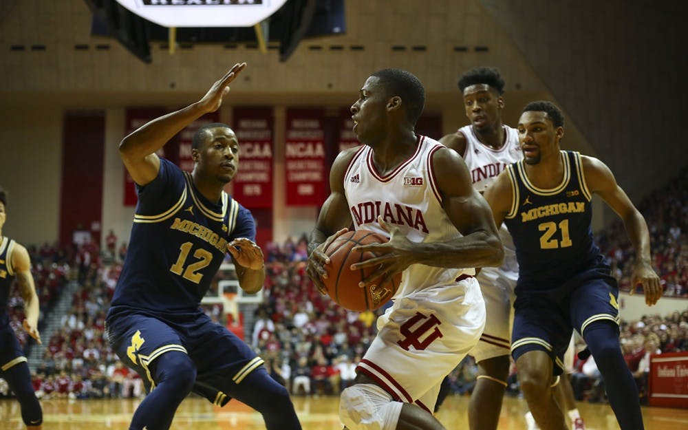 Junior guard Josh Newkirk looks for a pass in front of the Michigan net Sunday.  