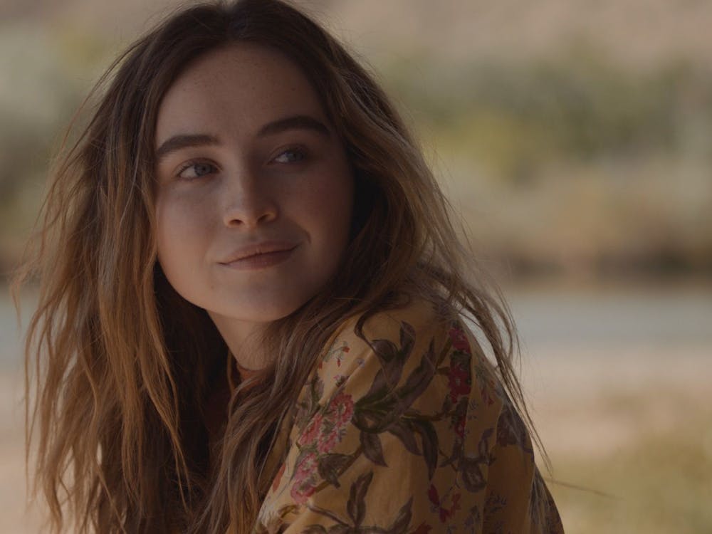 Sabrina Carpenter looks over shoulder in Ani Simon-Kennedy&#x27;s movie &quot;The Short History of the Long Road.&quot; In addition to being an actor, Carpenter is a singer who recently released her newest single &quot;Skin.&quot;