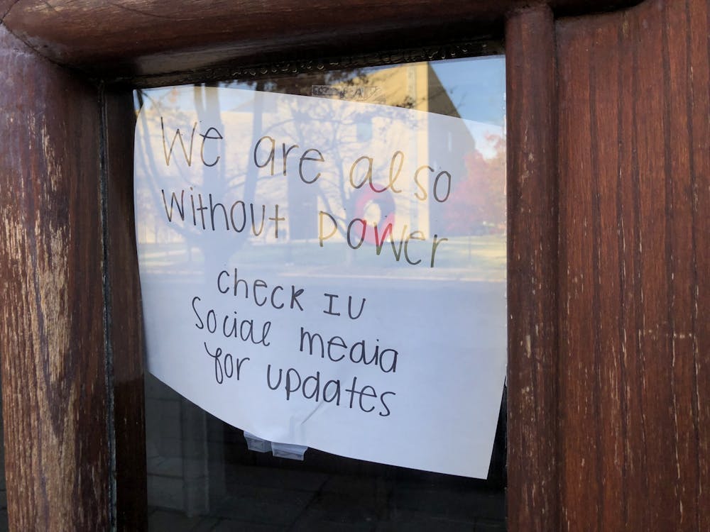 A sign posted to a door reads "we are also without power, check IU social media for updates" Nov. 8 at Woodburn Hall. Multiple buildings on campus were affected by a Duke Energy substation failure.