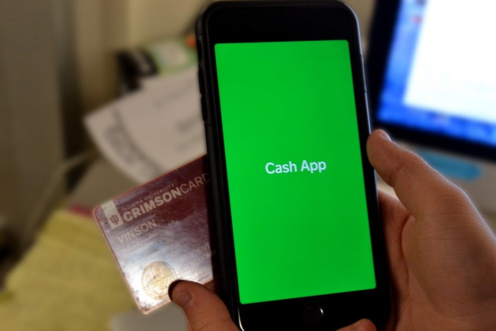 <p>A phone with the Cash App displayed is pictured next to a Crimson Card.</p>